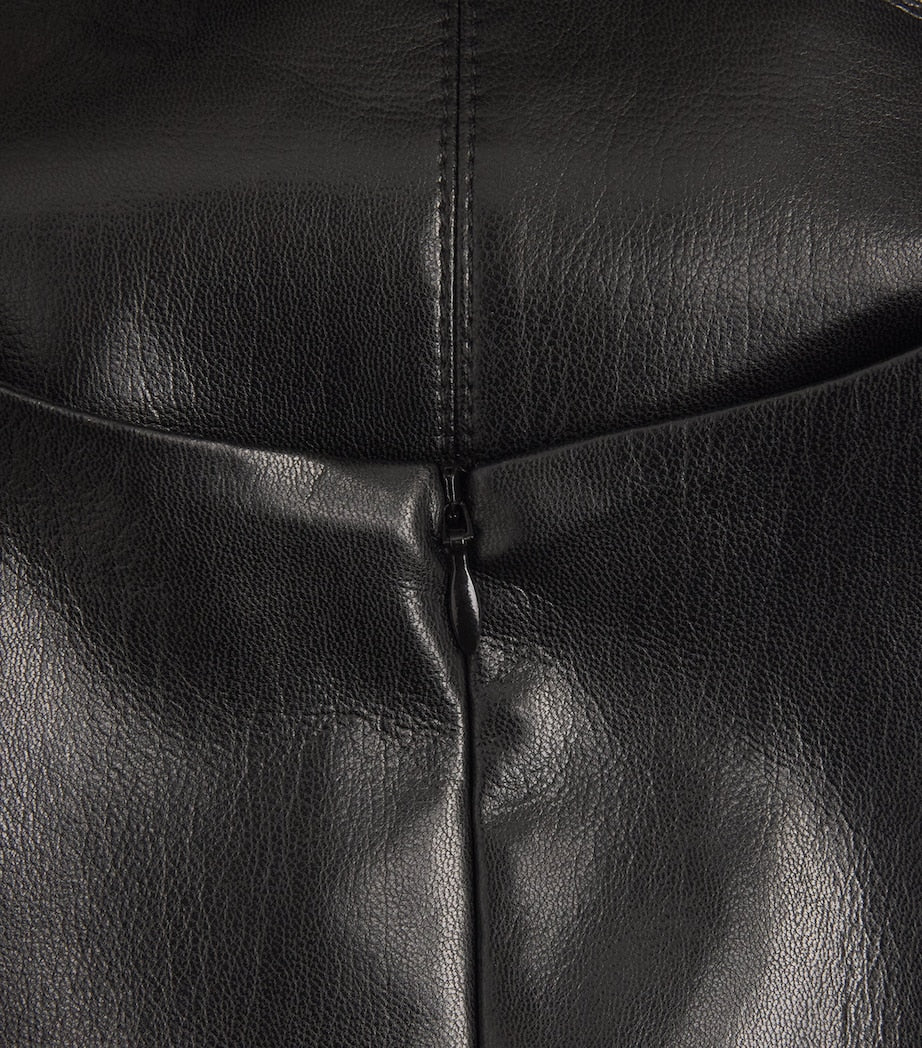 Close-up of black leather texture with a zipper