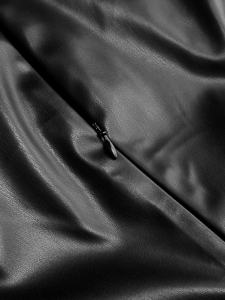 Close-up of black leather with a zipper