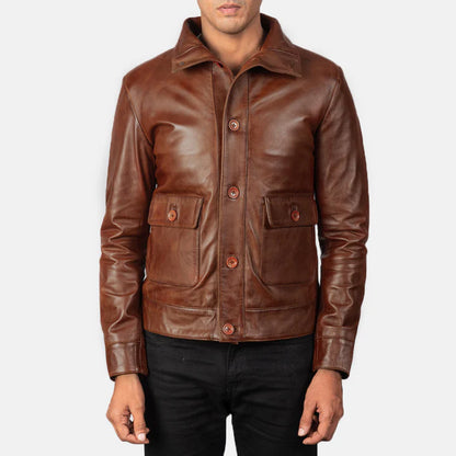 Brown leather jacket worn by a person on a white background
