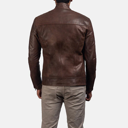 Brown leather jacket worn by a person on a white background