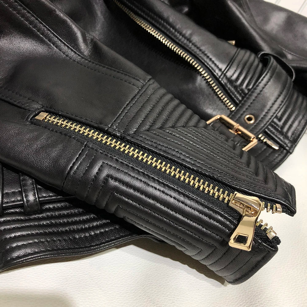 Women leather jacket black close-up double zipper and quilted leather detail gold hardware