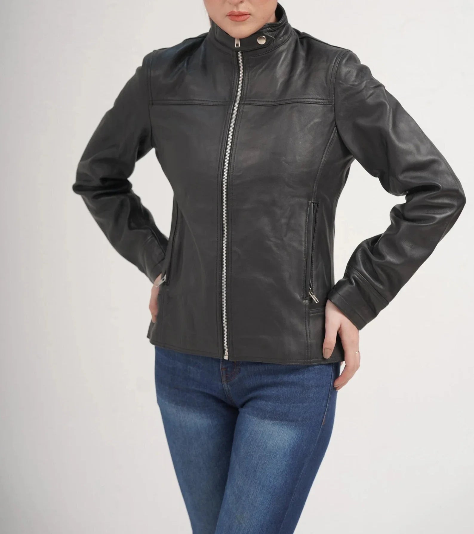 ZERXHIDE black leather jacket front view — zipped with silver zipper, snap collar, side zip pockets, women's lambskin biker jacket