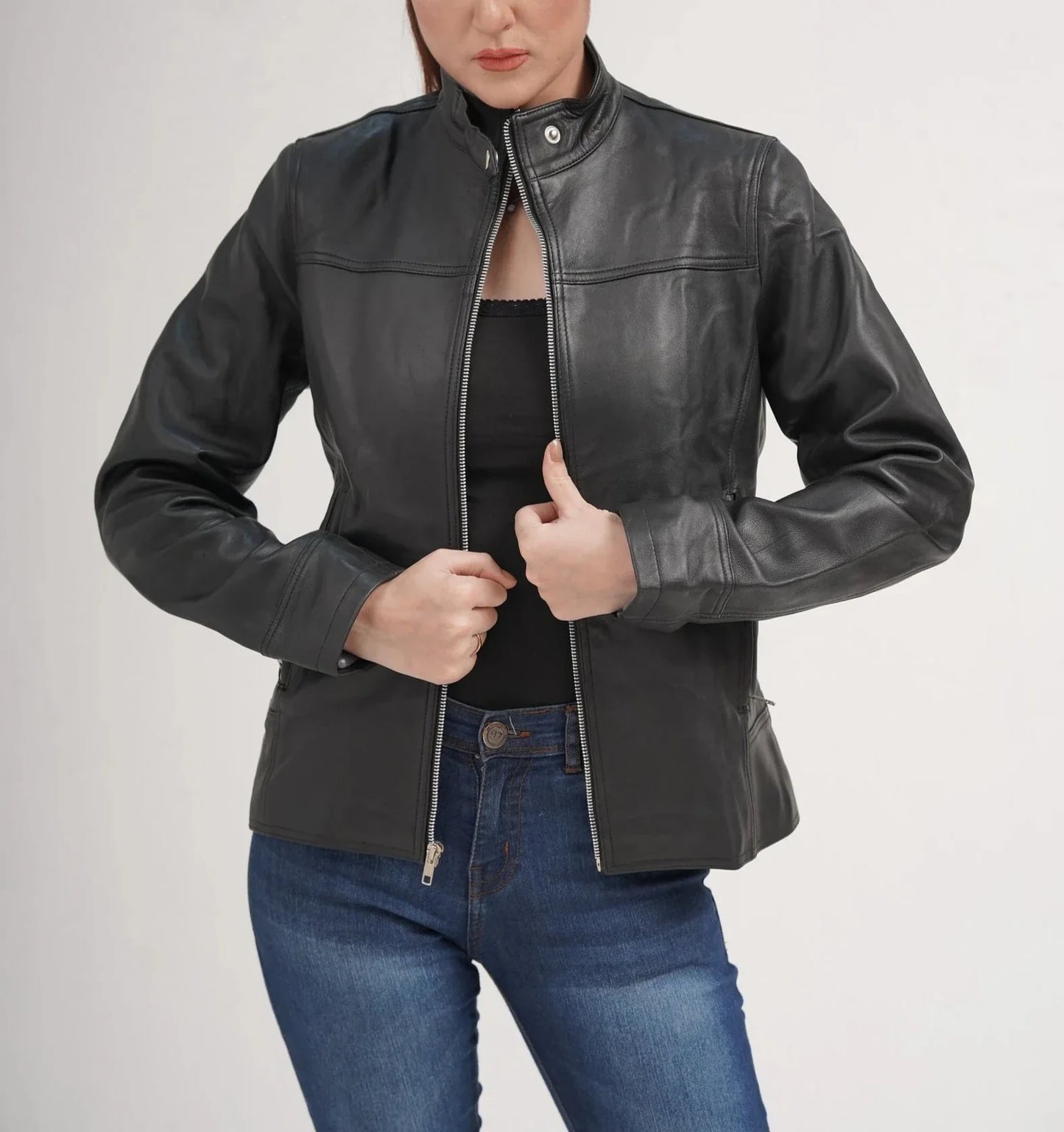 ZERXHIDE black leather jacket back view — fitted lambskin silhouette with panel seaming and band collar, styled with jeans