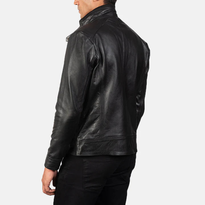 Black leather jacket worn by a person on a white background