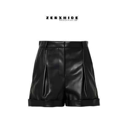 ZERXHIDE black leather shorts — front flat lay, high-waisted with front pleats and cuffed hem