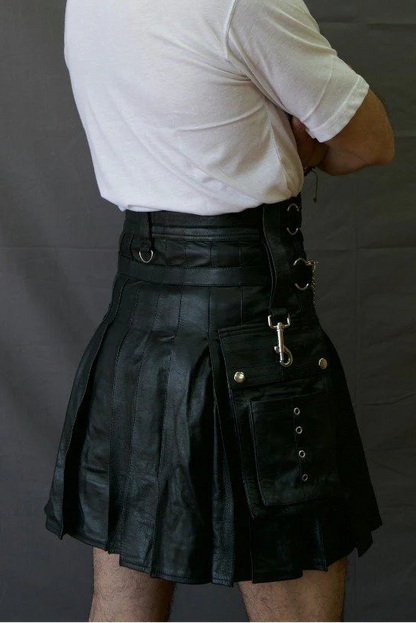 Man wearing a black leather kilt against a gray background