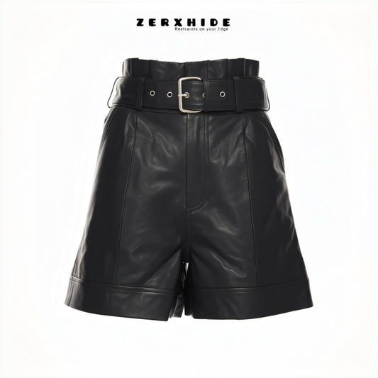 ZERXHIDE black leatherette shorts — front view with wide silver buckle belt and cuffed hem, high-waisted